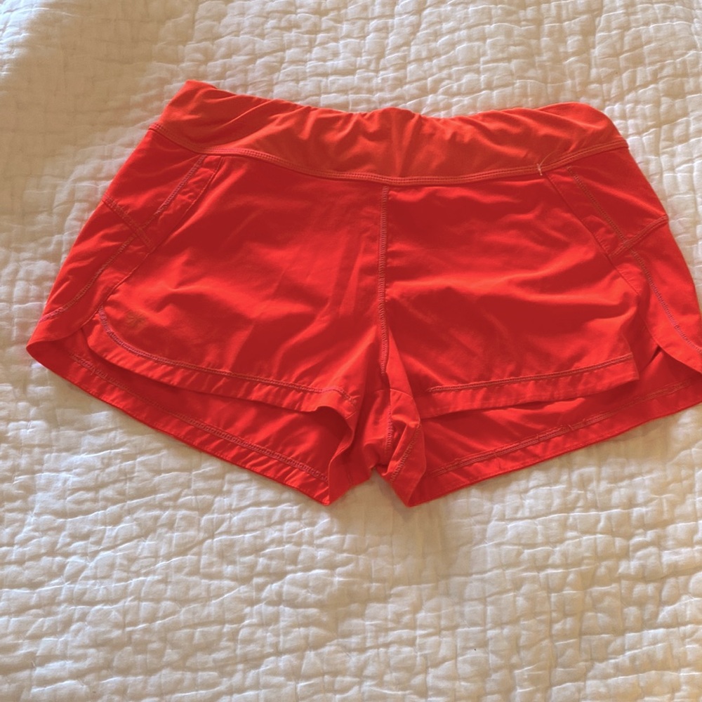 Athleta neon orange athletic shorts